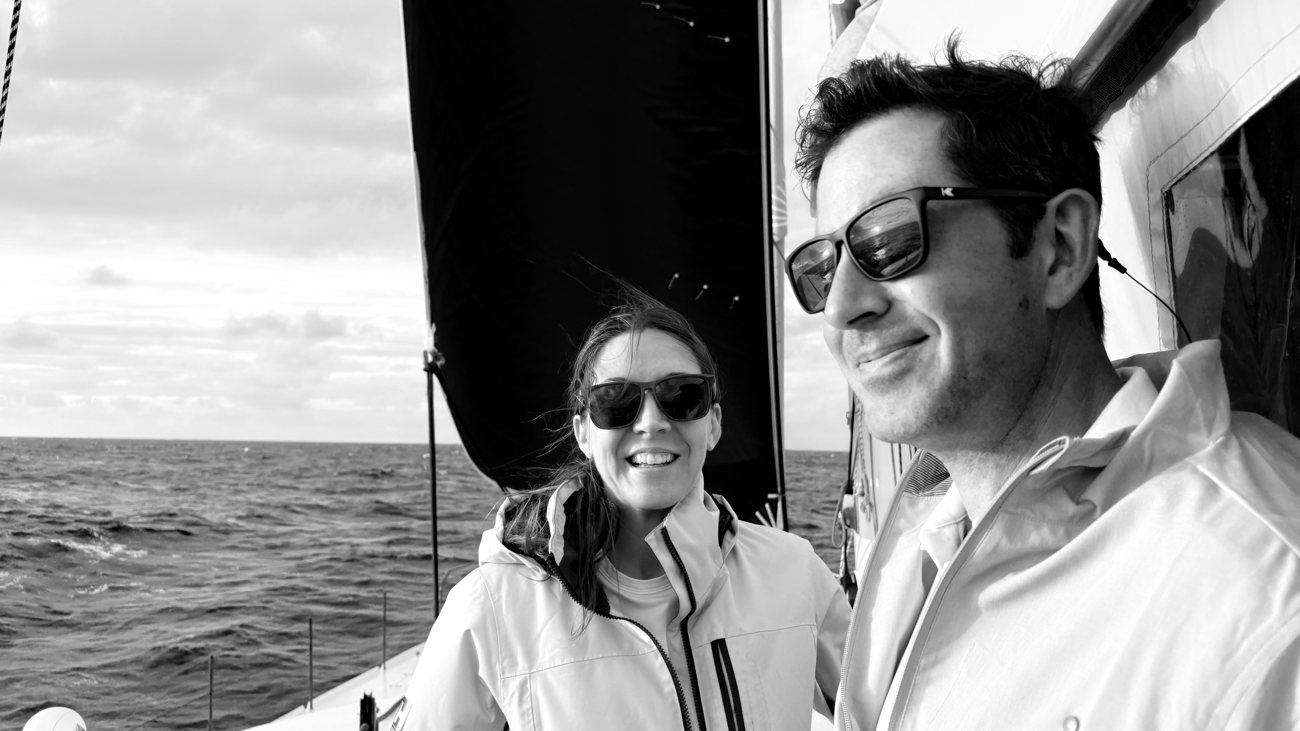 Julie and John Kollar aboard a sailing vessel offshore